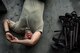 A 41st Helicopter Maintenance Unit crew chief, lays on the hangar floor next to a helicopter extraction ladder and other various equipment, Aug. 29, 2017, at Easterwood Airport, College Station, Texas. The 347th Rescue Group from Moody Air Force Base, Ga., sent aircraft and personnel in support of FEMA during Hurricane Harvey disaster response efforts. (U.S. Air Force photo by Staff Sgt. Ryan Callaghan)