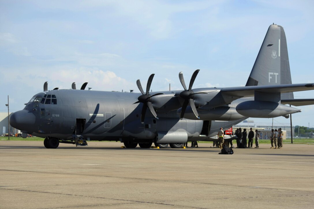 Airmen load supplies onto an aircraft.
