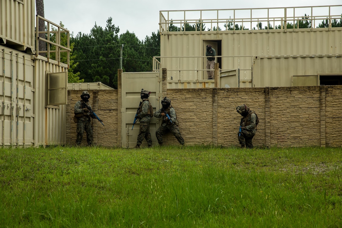 U.S. Marines with Battalion Landing Team 2nd Battalion, 6th Marine Regiment, 26th Marine Expeditionary Unit (MEU), provide security during force-on-force Military Operations in Urban Terrain (MOUT) training as part of Realistic Urban Training (RUT) at Camp Lejeune, N.C., Aug. 24, 2017.