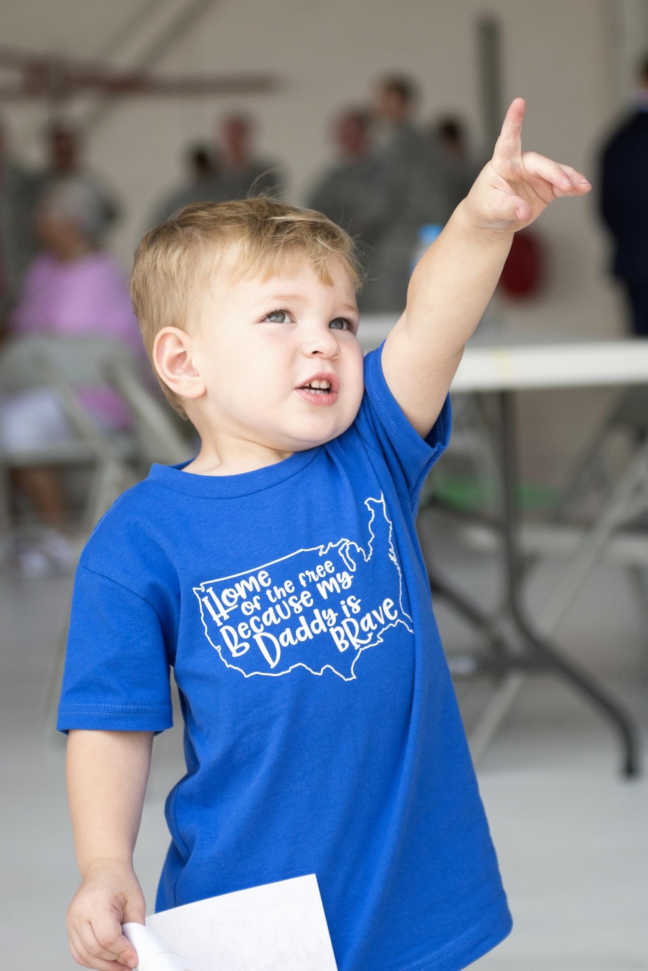 Mac Bowsher, 2, points towards the sky at a KC-135R Stratotanker carrying his father, Michael Bowsher, 434th Aircraft Maintenance Squadron integrated communications navigations specialist, prior to landing at Grissom Air Reserve Base, Ind., Aug. 24, 2017. Bowsher was one of nearly 100 Airmen that returned from deployments between Aug. 22-27, 2017. (U.S. Air Force photo/Tech. Sgt. Benjamin Mota)