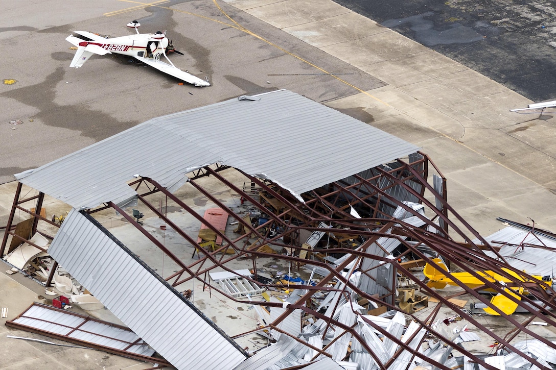 An aerial view showing the massive devastation to an airplane hangar caused by Hurricane Harvey