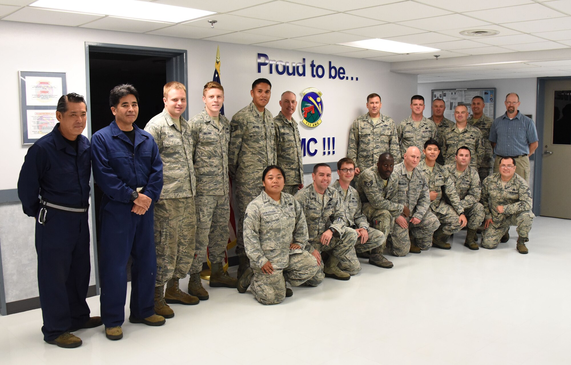 Maj. Gen. Christopher Bence, commander, USAF Expeditionary Center and Command Chief Master Sgt. Larry Williams, USAF EC command chief, pose with Airmen with the 733rd Air Mobility Squadron at Kadena Air Base, Japan, Aug. 21, 2017.  Bence and Williams along with the 515th Air Mobility Operations Wing leadership team visited three air mobility squadrons of the 515th AMOW in Japan and South Korea. (U.S. Air Force photo by Tech. Sgt. Jamie Powell)