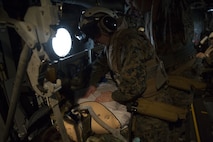 A corpsman presses on a simulated casualty’s chest to monitor its breathing during an en-route care training exercise for 2nd Medical Battalion at Camp Lejeune, N.C. on Aug 24, 2017.