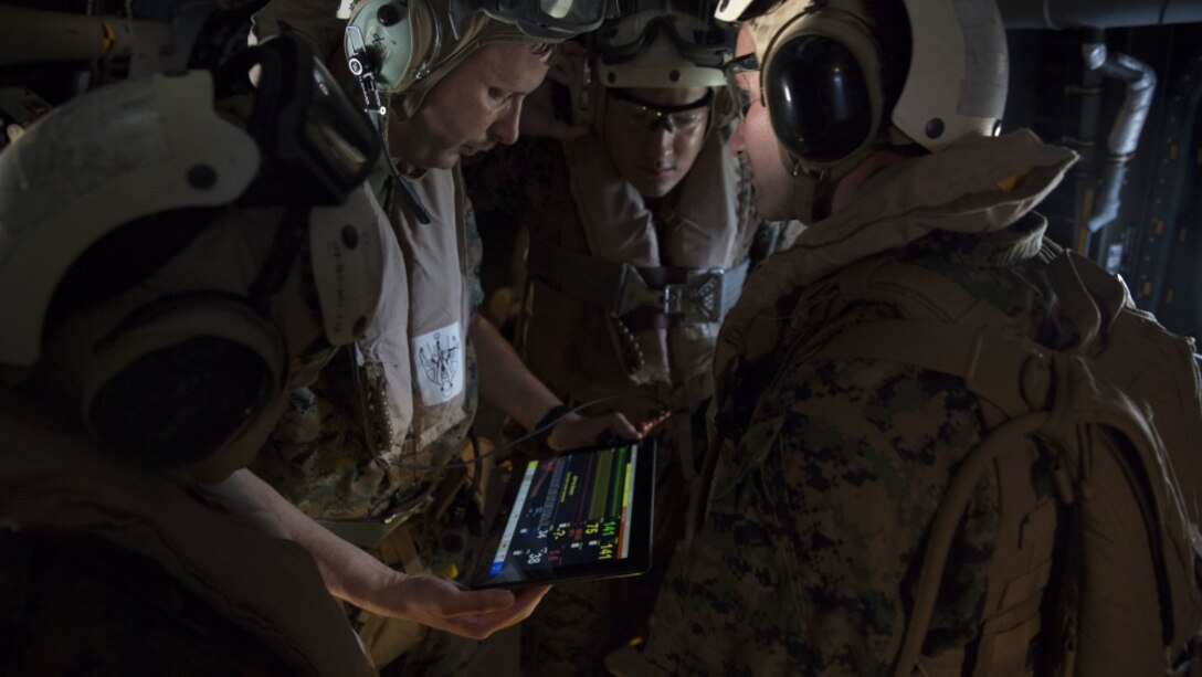 An instructor shows corpsmen how to watch for the heart rate at high altitude during an en-route care training exercise for 2nd Medical Battalion at Camp Lejeune, N.C. on Aug 24, 2017. The training was conducted to prepare corpsmen to successfully aid casualties while transporting them via aircraft to a higher level of medical attention. The sailors are with 2nd Medical Battalion. (U.S. Marine Corps photo by Pvt. Nicholas Guevara)