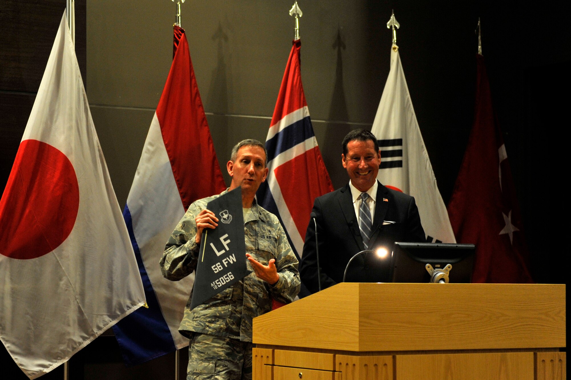 Lt. Col. Larry Fowler, 56th Fighter Wing wing chaplain, presents Steve Fedyski, Chief Operating Officer at Pure Flix Entertainment, with an appreciation award at Luke Air Force Base, Ariz. August 23, 2017. Fedyski came to Luke as a guest speaker during a faith and leadership seminar at the Academic Training Center.  (U.S. Air Force photo/Airman 1st Class Pedro Mota)