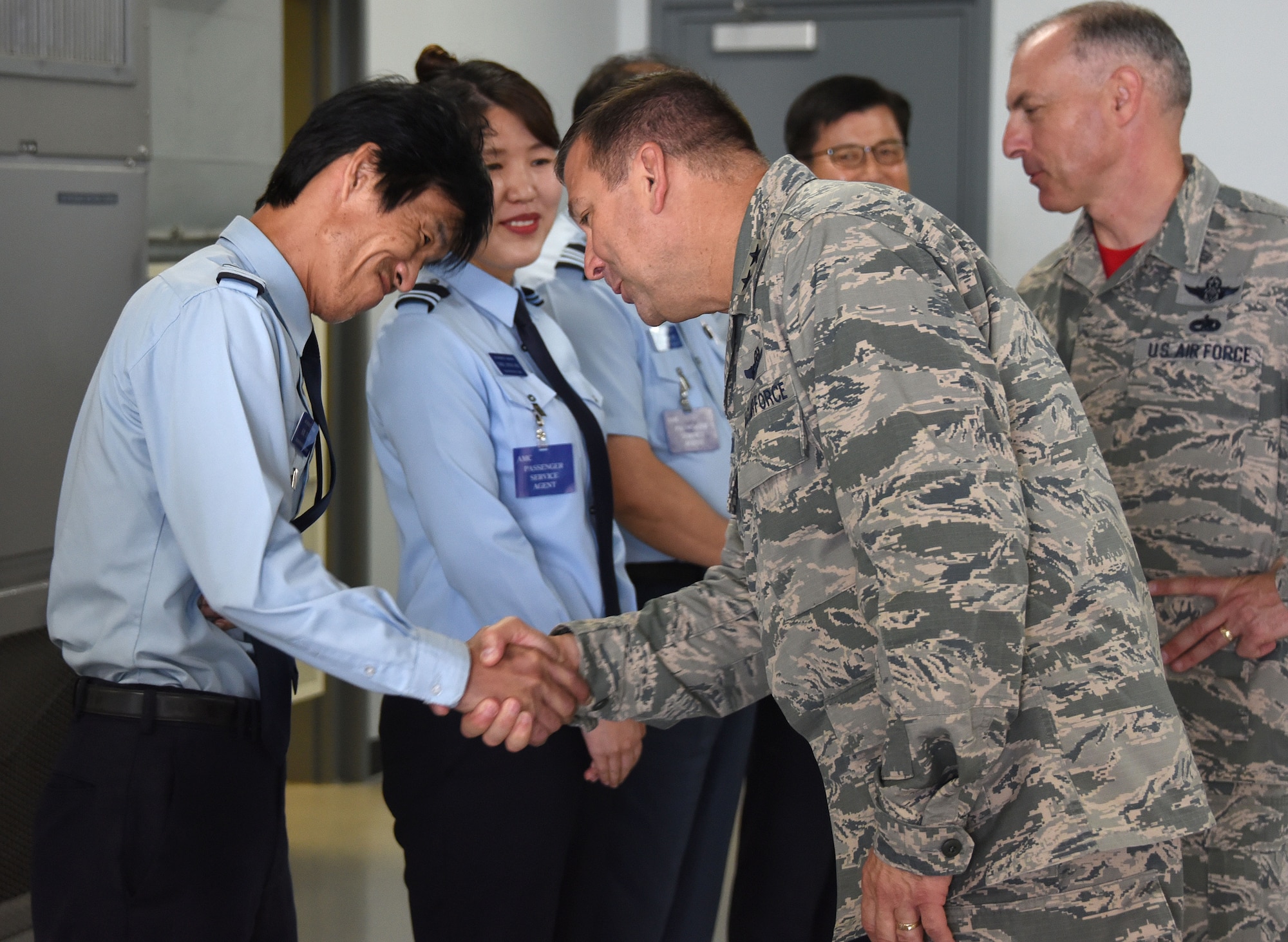Maj. Gen. Christopher Bence, commander, USAF Expeditionary Center and Command Chief Master Sgt. Larry Williams, USAF EC command chief, greet Republic of Korea air force airmen while at Osan Air Base, Republic of Korea, Aug. 25, 2017. Bence and Williams along with the 515th Air Mobility Operations Wing leadership team visited three air mobility squadrons of the 515th AMOW in Japan and Republic of Korea. (U.S. Air Force photo by Tech. Sgt. Jamie Powell)