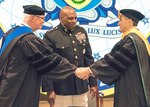 DIA Director Lt. Gen. Vincent Stewart, USMC, (center) presided at the formal change of Presidency as Dr. David R. Ellison (left) transferred the authority, responsibility, and accountability for NIU to Dr.  J. Scott Cameron on Friday, 25 August 2017.