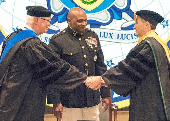 DIA Director Lt. Gen. Vincent Stewart, USMC, (center) presided at the formal change of Presidency as Dr. David R. Ellison (left) transferred the authority, responsibility, and accountability for NIU to Dr.  J. Scott Cameron on Friday, 25 August 2017.