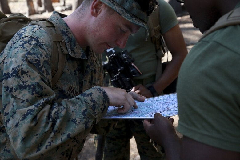 Pfc. Jesse Hawk, a military policeman with 3rd Law Enforcement Battalion, finds points on a map during a land navigation course as part of Mountain Warfare Training in Bridgeport, Calif., Aug. 25, 2017.