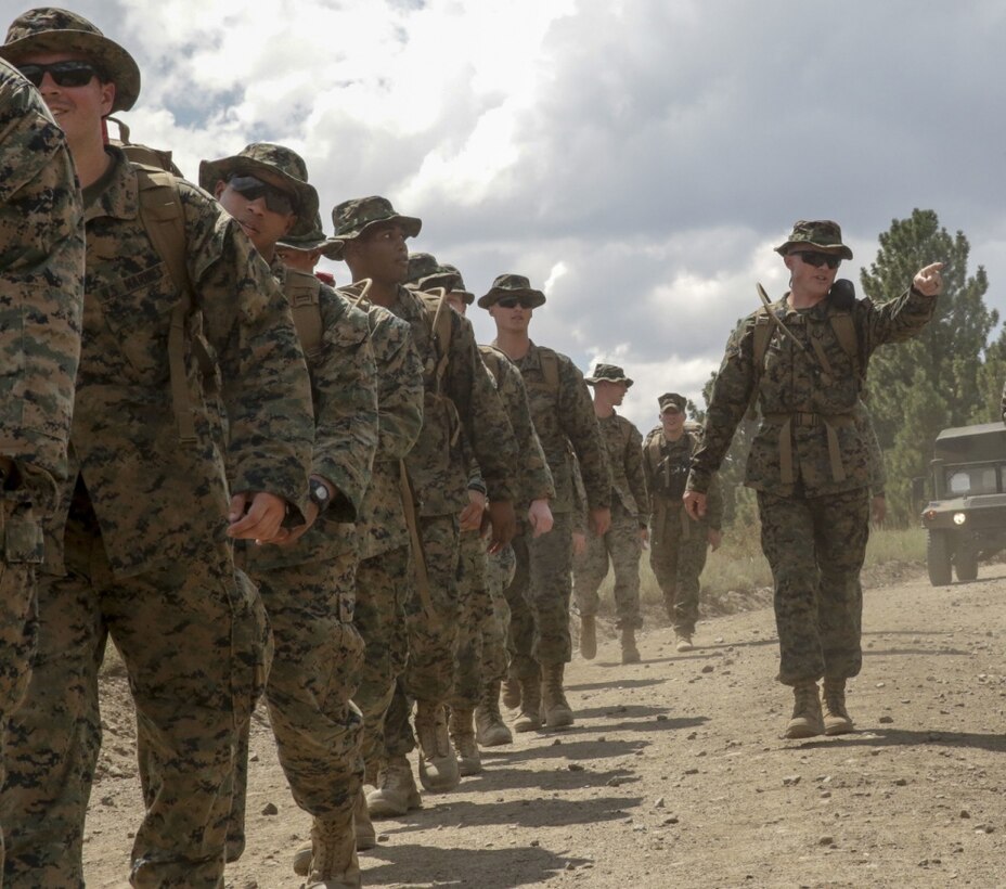 1st Sgt. Joshua Brown, company first sergeant of 2nd Law Enforcement Battalion Headquarters Group, motivates Marines during a conditioning hike as part of the Mountain Warfare Training exercise in Bridgeport, Calif., Aug. 22, 2017.