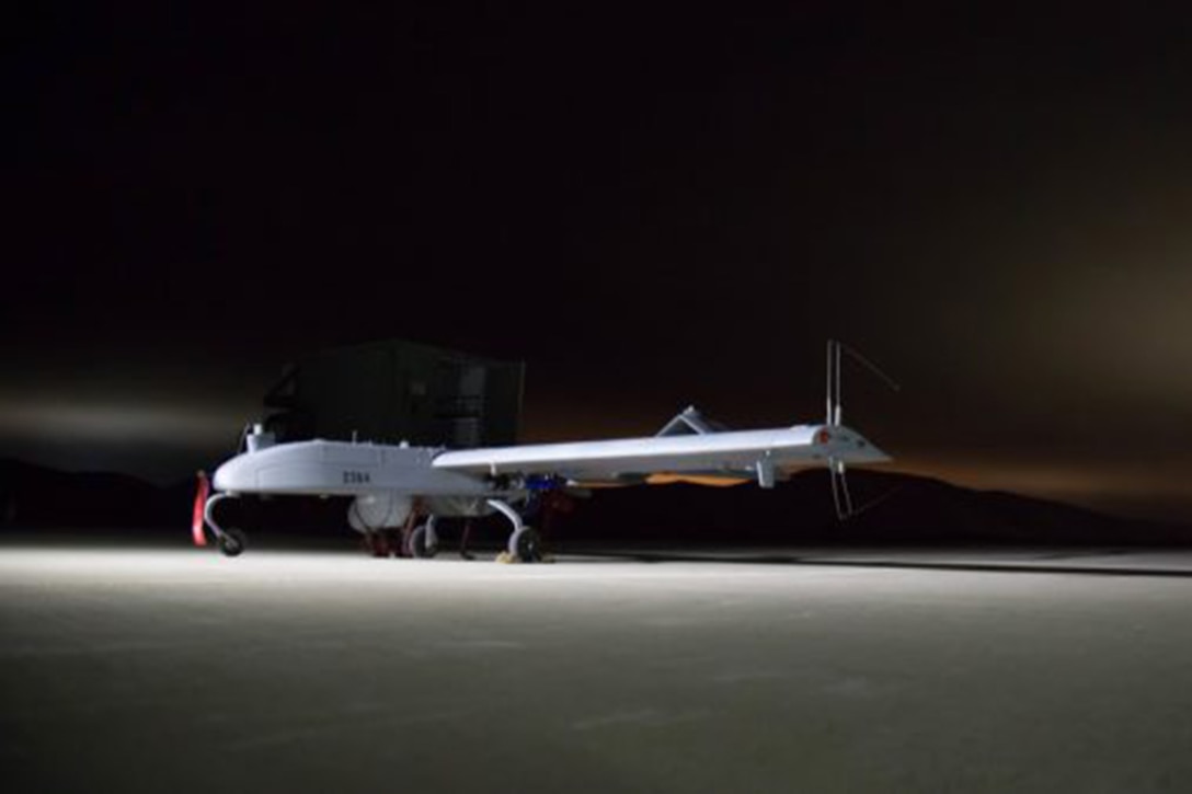 An unmanned aircraft is loaded onto a launcher.