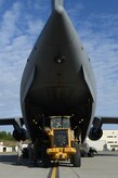 Airmen load cargo on a C-17 Globemaster III, at Joint Base Elmendorf-Richardson, Alaska, Aug. 28, 2017, preparing to leave for Texas to provide humanitarian support after Hurricane Harvey. The Air National Guard 176th Wing sent personnel from the 212th Rescue Squadron to provide search-and-rescue, and support aeromedical evacuation and humanitarian relief.