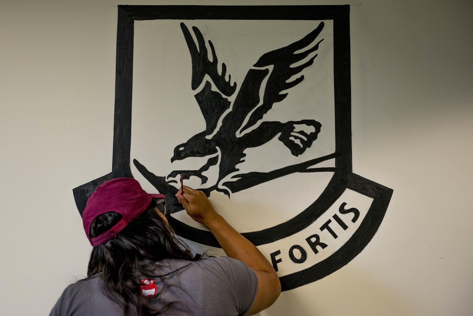 Stockett’s images include the swooping eagle of the Air Force security force’s logo and an American flag with a blue stripe representing police officers.