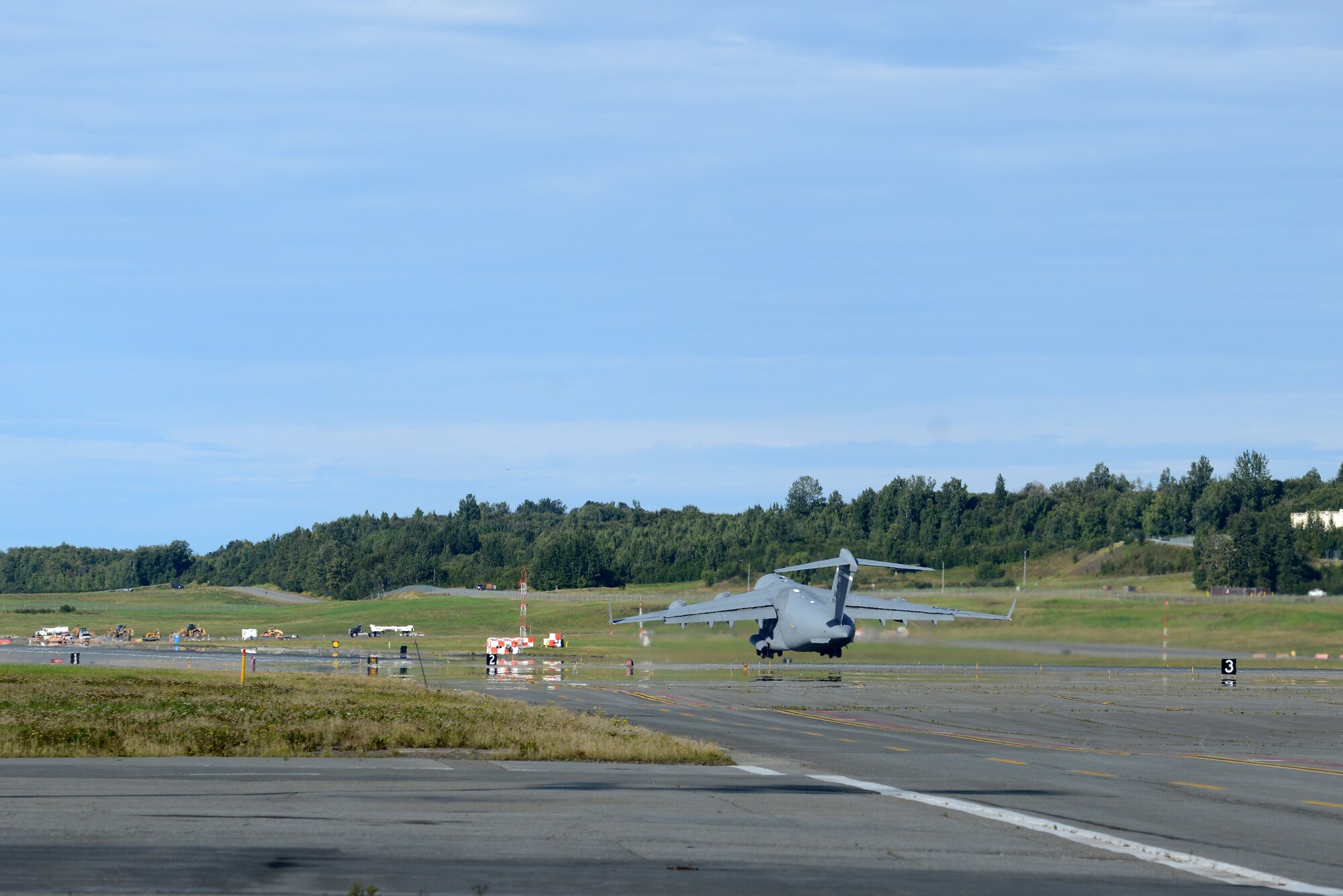 A C-17 Globemaster III, at Joint Base Elmendorf-Richardson, Alaska, Aug. 28, 2017, leaves for Moffett Airfield, California, to retrieve two helicopters en route to Texas to provide humanitarian support after Hurricane Harvey. The Air National Guard 176th Wing sent personnel from the 212th Rescue Squadron to provide search-and-rescue, and support aeromedical evacuation and humanitarian relief.