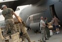 Oregon Air National Guardsmen from the 125th Special Tactics Squadron pack food and equipment aboard a C-130 Hercules assigned to the 123rd Airlift Wing, Kentucky Air National Guard, as they prepare to leave the Portland Air National Guard Base, Ore., Aug. 29, 2017. Approximately 17 Oregon from the 125th Special Tactics Squadron will also be joined by 3 members of the Air Force Reserve 304th Rescue Squadron, as they travel to Ellington Field Joint Reserve Base, Houston, Texas. (U.S. Air National Guard photo/Master Sgt. John Hughel, 142nd Fighter Wing Public Affairs)