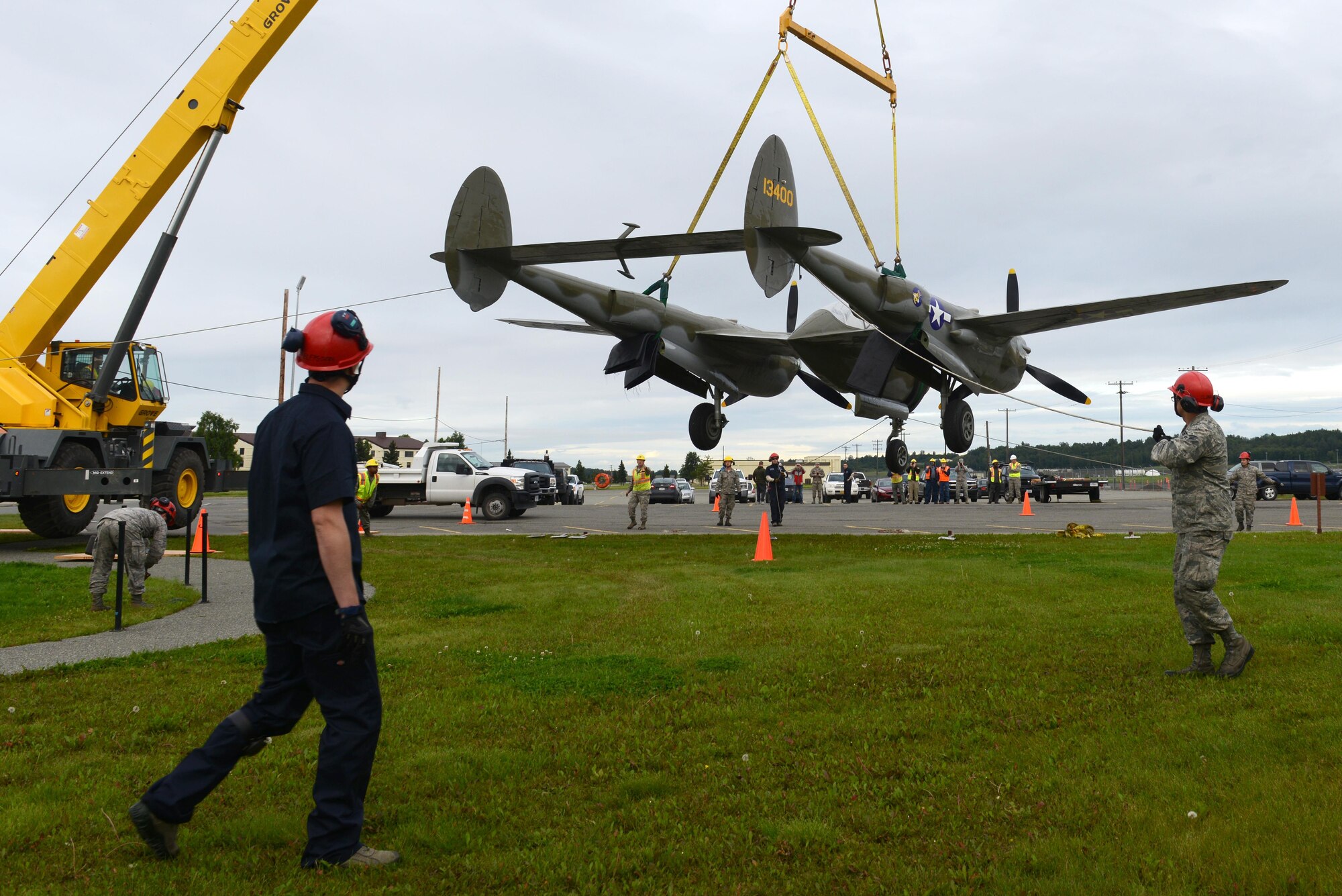The 3rd Maintenance Squadron crash recovery team and 773d Civil Engineer Squadron structure shop return the newly refurbished Lockheed P-38 Lightning to the 3rd Wing at Joint Base Elmendorf-Richardson, Alaska, Aug. 26, 2017. The aircraft has been a static display at JBER since May of 2000 as a reminder of the sacrifices made in the ‘Forgotten War’ of the Aleutian Island chain; the restoration program started in August of 2016.