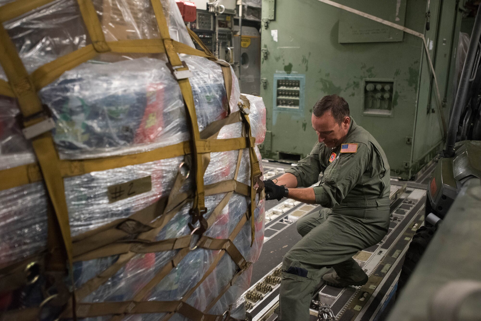 Master Sgt. Jesse Spainhour, a crew chief from the Tennessee Air Guard, pulls a pallet of equipment from the Kentucky Air Guard’s 123rd Contingency Response Group onto a C-17 Globemaster III at the Kentucky Air National Guard Base in Louisville, Kentucky, Aug. 29, 2017 in preparation for Hurricane Harvey rescue efforts in Texas. More than 40 Airmen from the Kentucky and Mississippi Air National Guard are deploying to George Bush Intercontinental Airport in Houston, where they will rapidly establish airfield, aeromedical evacuation and cargo operations. (U.S. Air National Guard  photo by Master Sgt. Phil Speck)
