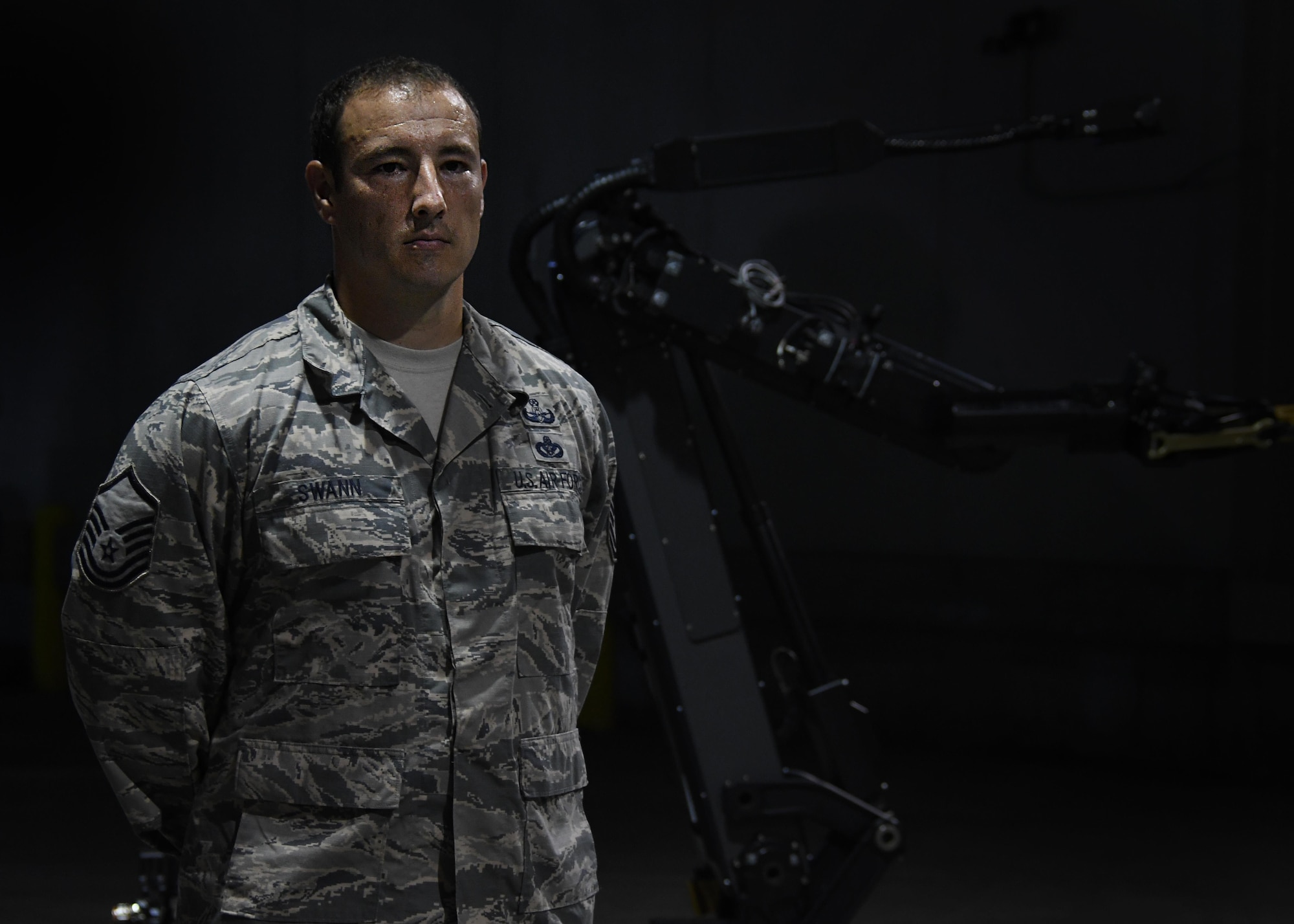 Master Sgt. Richard Swann, 94th explosive ordnance disposal flight operations section chief, poses for a photo in front of an EOD robot in a hangar at Hartsfield Jackson International Airport, Atlanta on Aug. 23, 2017. Swann helped coordinate this year's Eastern Robot Rodeo, hosted at Dobbins Air Reserve Base, Ga. (U.S. Air Force photo/Staff Sgt. Miles Wilson)