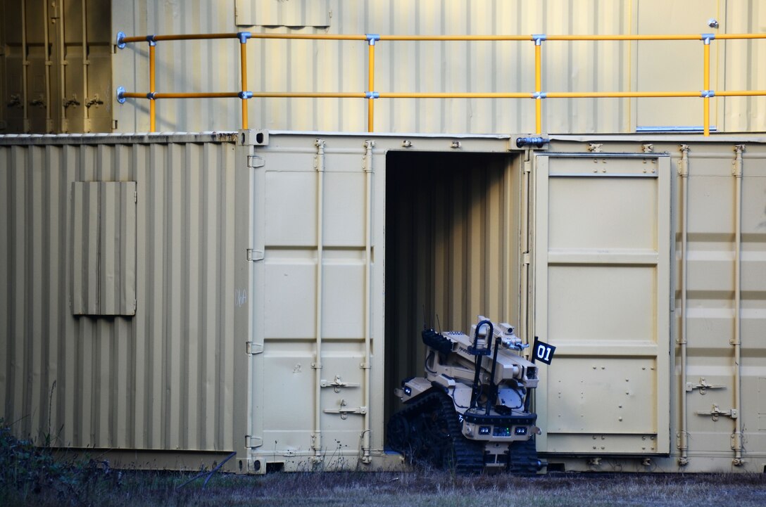 An explosive ordnance disposal robot enters a shipping container during this year's Eastern Robot Rodeo at Dobbins Air Reserve Base, Ga. Aug. 24, 2017. The Robot Rodeo included seven different training scenarios throughout the week-long event, with each scenario relying on different sized robots and techniques for completing the mission. (U.S. Air Force photo/Don Peek)
