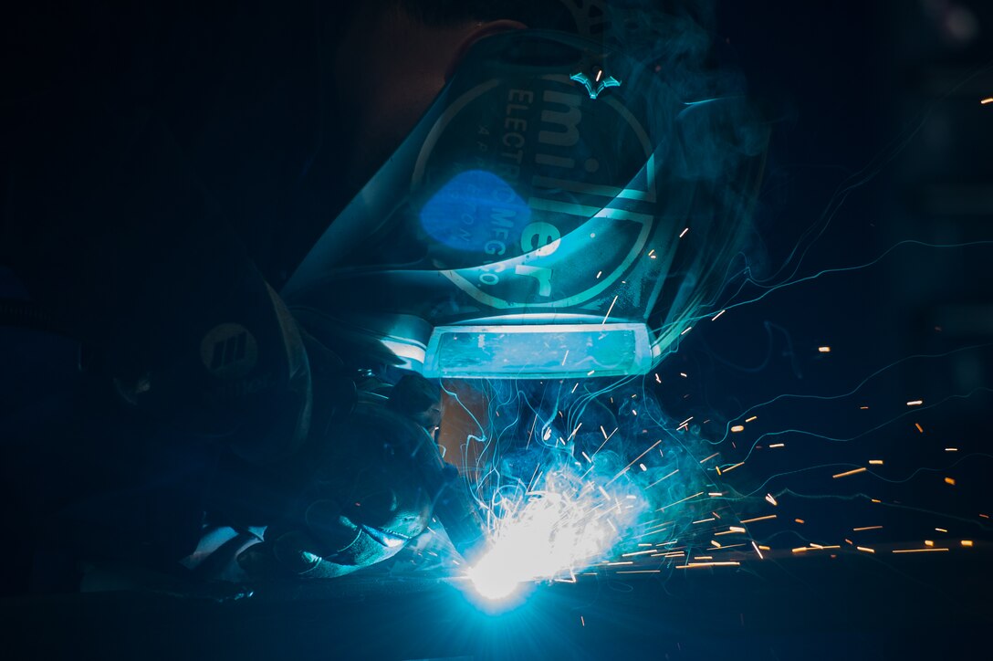 U.S. Air Force Airman 1st Class Jordan Mann, 1st Maintenance Squadron metals technology journeyman, welds a piece of metal at Joint Base Langley-Eustis, Va., Aug. 17, 2017. The job of a 1st MXS metals technicians is to provide support for the flightline by fixing basic and major aircraft damages through metal work. (U.S. Air Force photo by Senior Airman Derek Seifert)