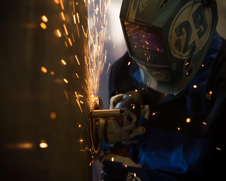 U.S. Air Force Airman 1st Class David Norgaard, 1st Maintenance Squadron metals technology apprentice, removes a piece of metal at the metals technology shop at Joint Base Langley-Eustis, Va., Aug. 17, 2017. “Measure twice, cut once” is the moto that metal technicians operate by to ensure the accuracy and precision of their work. (U.S. Air Force photo by Senior Airman Derek Seifert)