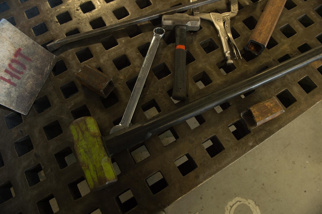 Tools that were requested for manufacturing are laid out on a bench in the metals technology shop at Joint Base Langley-Eustis, Va., Aug. 22, 2017. Metal technicians have little to no room for error when performing their job, since a mistake as small as a third of the diameter of a human hair could cost a pilot or aircrew member their life. (U.S. Air Force photo by Senior Airman Derek Seifert)