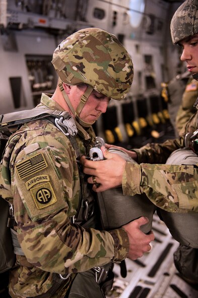 U.S. Army soldiers from the 1st Squadron, 40th Cavalry Regiment prepare to drop from a U.S. Air Force C-17 piloted by the 317th Airlift Squadron. Photo taken by U.S. Air Force Staff Sgt. Garrett Wake on 24 August, 2017. (Staff Sgt. Garrett Wake)