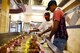 Airmen 1st Class Germaine Williams, right, and Zachary Mack, both 23d Force Support Squadron services apprentice, place shish kabobs on a grill during the Georgia Pines Top Chef competition, Aug. 28, 2017, at Moody Air Force Base, Ga. The morning and evening shifts competed against each other with the winning team receiving the title of “Top Chef” along with a day off from work. (U.S. Air Force photo by Airman Eugene Oliver)