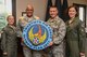 Maj. Gen. Anthony Cotton, 20th Air Force commander, and the three Operations Group Commanders (from left to right) Col. Anita Feugate-Opperman, 341st OG commander; Col. Bob Ewers, 90th OG commander; and Col. Catherine Barrington, 91st OG commander pose for the 20th Air Force Olympic Flag presentation at the Eubanks Conference Center at Barksdale Air Force Base, La., Aug 29, 2017. (U.S. Air Force Photo/Airman 1st Class Sydney Campbell)