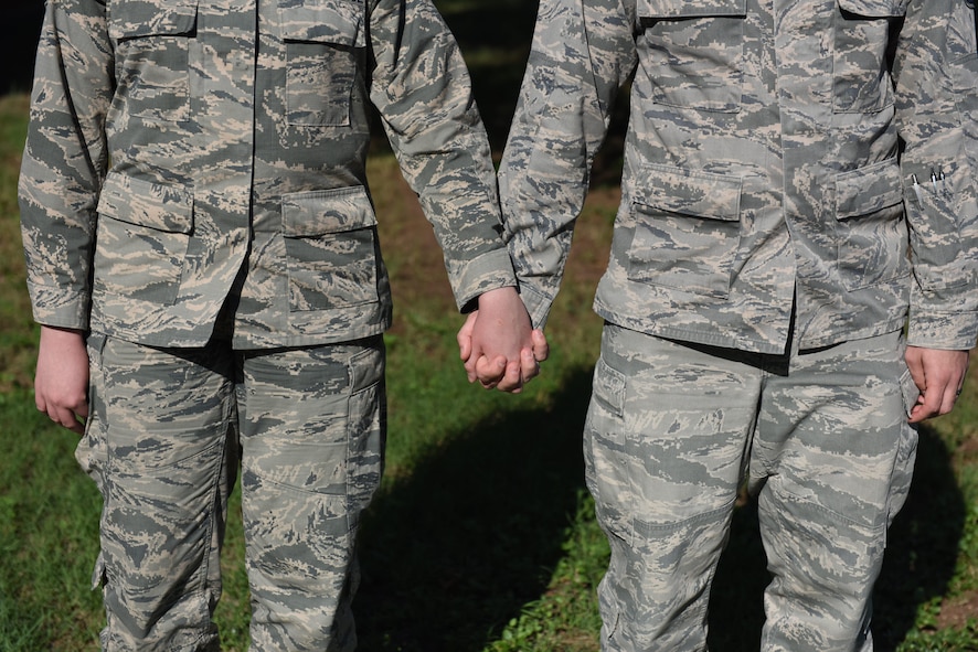 Illustration photo of a military couple holding hands.