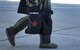 A 64th Aggressor pilot walks on the flight line after a Red Flag 17-4 exercise sortie on Nellis Air Force Base, Nevada Aug. 25, 2017. During Red Flag, aggressor pilots to fly day and night sorties in addition to detailed planning to maintain readiness. (U.S. Air Force photo by Senior Airman Kevin Tanenbaum/Released)