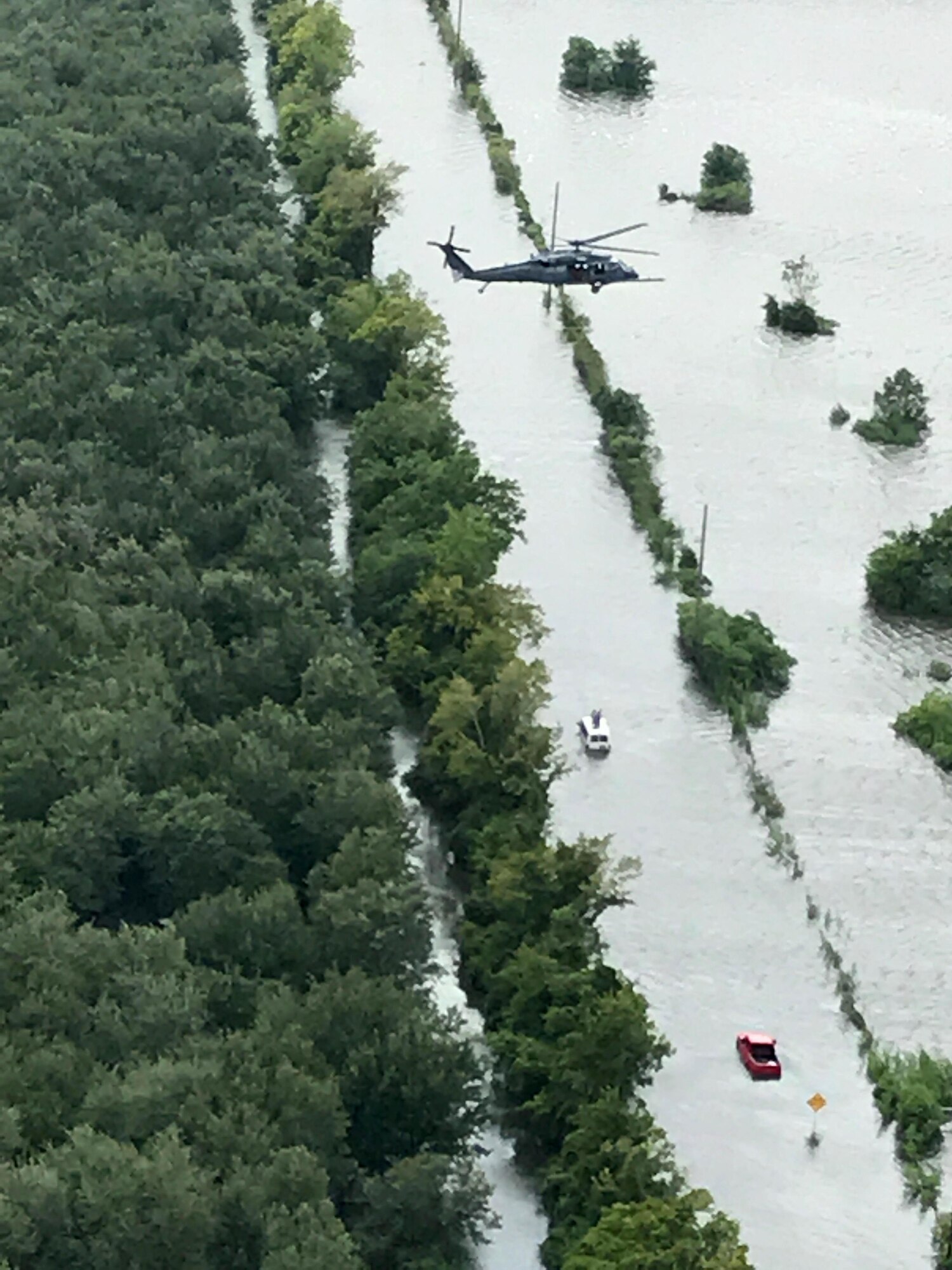 Maj. Jason Tomas, HH-60G Pave Hawk helicopter pilot and his crew rescued five people their first day on the job August 29, 2017. From high above in the sky he saw a hand wave from a submerged white van, it ended up being the local sheriff and two more inside. He and his crew got them all to safety. Rescuing victims from the aftermath of Hurricane Harvey in Texas August 30, 2017. Approximately 94 Citizen Airmen have joined forces with their northern neighbors at Moody Air Force Base, Georgia, the 23rd Rescue Wing, and are operating out of College Station, Texas to rescue people affected by the aftermath of Hurricane Harvey in support of Air Force’s Northern search and rescue mission for FEMA disaster relief efforts. (U.S. Air Force photo)