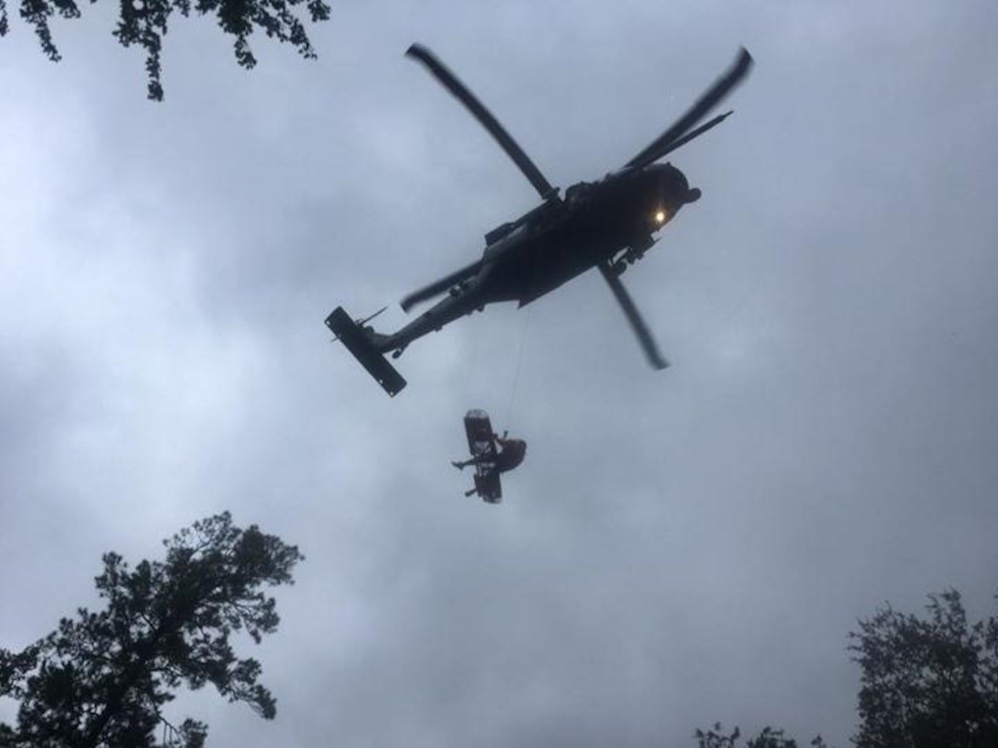 Maj. Jason Tomas, HH-60G Pave Hawk helicopter pilot and his crew rescued five people their first day on the job August 29, 2017 hoisting them up from the flooded Texas grounds below. Approximately 94 Citizen Airmen have joined forces with their northern neighbors at Moody Air Force Base, Georgia, the 23rd Rescue Wing, and are operating out of College Station, Texas to rescue people affected by the aftermath of Hurricane Harvey in support of Air Force’s Northern search and rescue mission for FEMA disaster relief efforts. (U.S. Air Force photo)