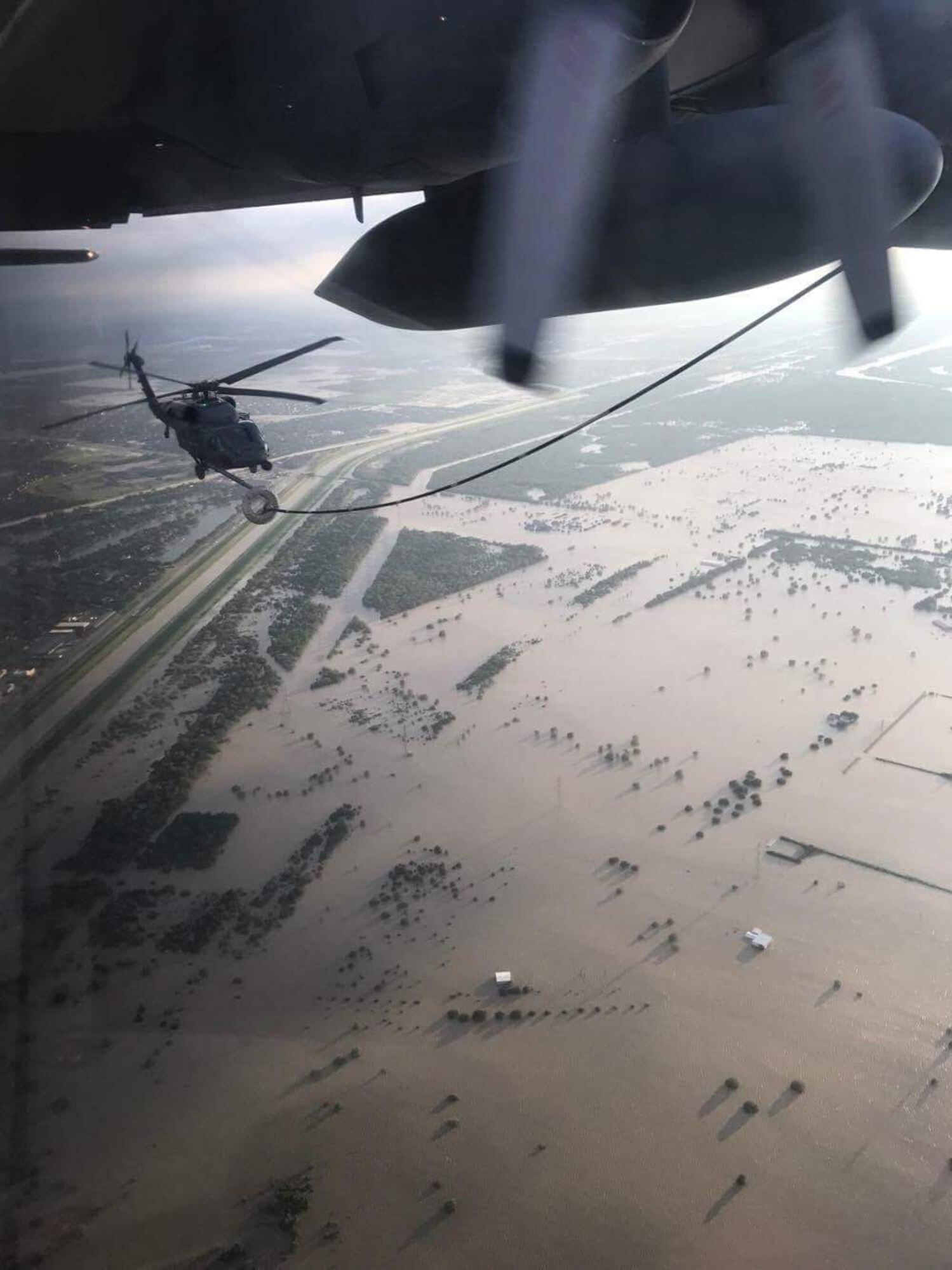 A 920th HH-60G Pave Hawk helicopter crew refuels from a wing HC-130P/N King refueler in-between rescuing victims from the aftermath of Hurricane Harvey in Texas August 30, 2017. Approximately 94 Citizen Airmen have joined forces with their northern neighbors at Moody Air Force Base, Georgia, the 23rd Rescue Wing, and are operating out of College Station, Texas to rescue people affected by the aftermath of Hurricane Harvey in support of Air Force’s Northern search and rescue mission for FEMA disaster relief efforts. (U.S. Air Force photo)