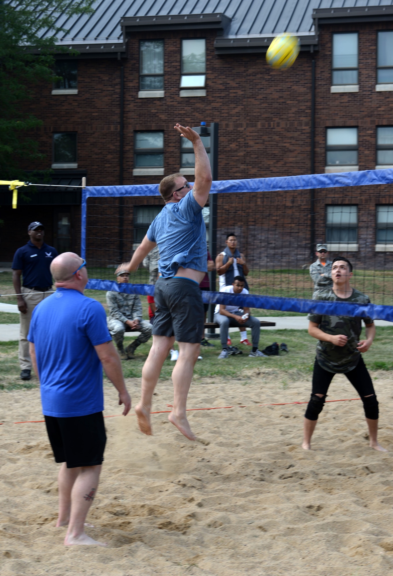 CMSgt. Adam Vizi, the 28th Bomb Wing command chief, hits a volleyball over a net Aug. 25, 2017 on Ellsworth Air Force Base, S.D. Wingmen Day included a base picnic called the Summer Bash where food and beverages were served and senior NCOs played a volley ball game against Airmen. (U.S. Air Force photo by Airman 1st Class Thomas Karol)