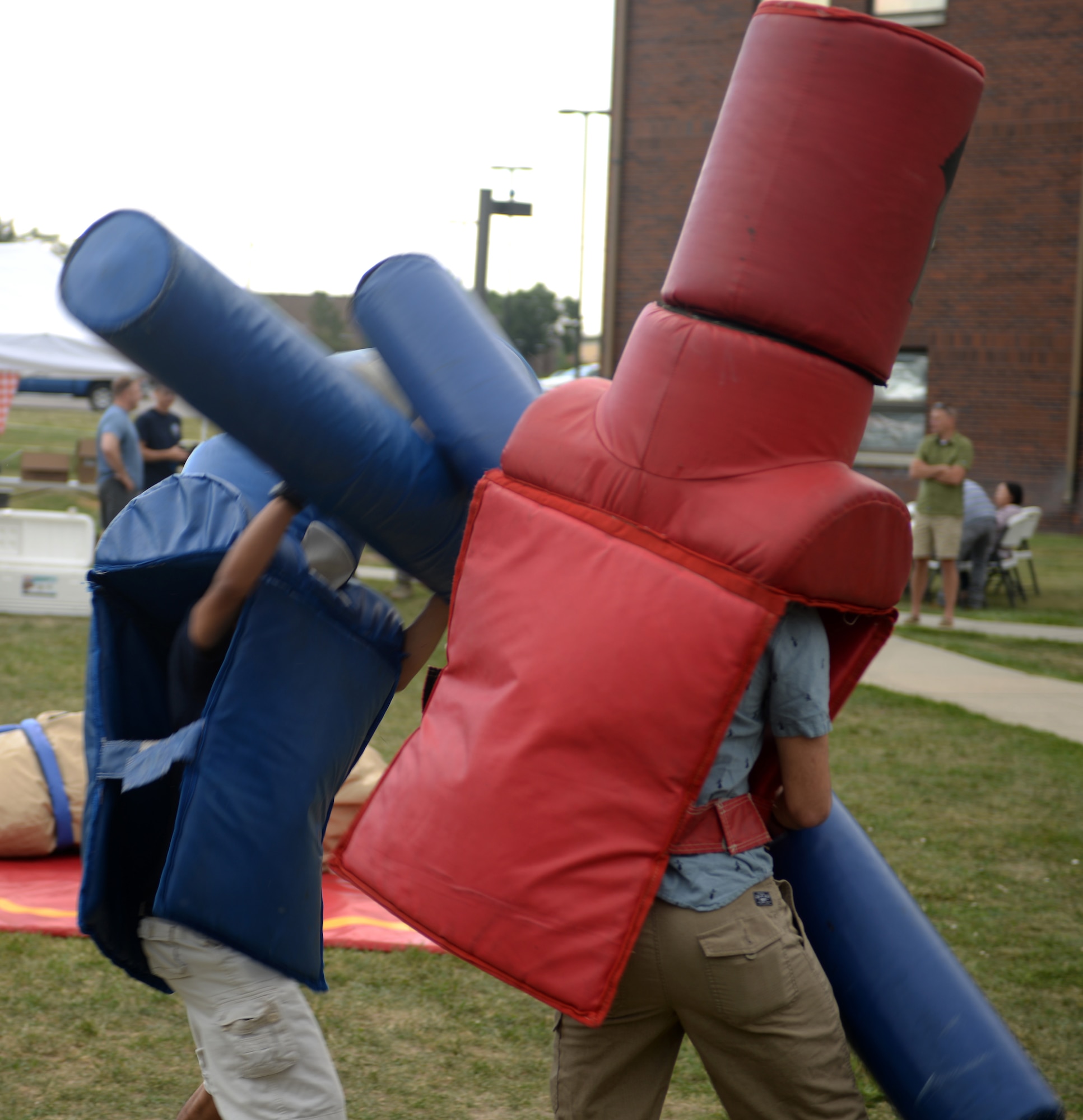 Two Airman challenge each other with pugil sticks at the Summer Bash picnic Aug. 25, 2017 on Ellsworth Air Force Base, S.D. There were multiple games played at the base picnic, including wrestling in Sumo suits, cornhole, horseshoe tossing, and volleyball. (U.S. Air Force photo by Airman 1st Class Thomas Karol)