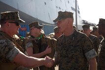 Lt. Gen. Mark A. Brilakis, Commander, U.S. Marine Corps Forces Command, greets Marines from Combat Logistics Battalion 26 as they prepare to embark on LHD-3 aboard Naval Operating Base Norfolk, Va., Aug. 30. Marines and sailors with CLB 26 have prepared to provide humanitarian support to the citizens of Texas who were impacted by Hurricane Harvey. (Official Marine Corps Photo by Master Sgt. Ryan O’Hare/Released)