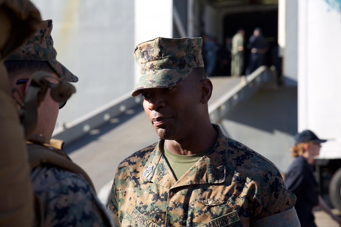 Sgt. Maj. Christopher Robinson, sergeant major, U.S. Marine Corps Forces Command, speaks with Marines preparing to depart on LHD-3 at Naval Operating Base Norfolk, Aug. 30. Marines and sailors from Combat Logistics Battalion 26, based out of Marine Corps Base Camp Lejeune, N.C., are preparing to travel to Texas and provide relief support in response to Hurricane Harvey. (Official Marine Corps Photo by Master Sgt. Ryan O’Hare/Released)