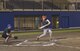 Michael Davis, 374th Wing Staff Agency, hits the ball during the fifth inning of an intramural softball game against the 36th Airlift Squadron team at Yokota Air Base, Japan, Aug. 28, 2017. Davis’ hit enabled him to reach first before scoring WSA’s second run of the inning giving AS a one run lead, 12-11. (U.S. Air Force photo by Staff Sgt. David Owsianka)