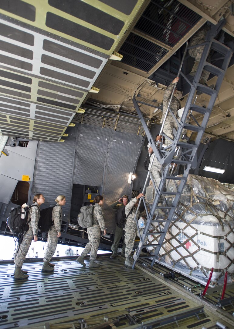 59th Medical Wing members start boarding into a Lockheed C-5 Galaxy as the disaster relief team to Houston, Texas, August 30. More than 70-members of the Air Force’s flagship medical wing were mobilized to provide medical attention to the 6 million residents of the greater Houston area, after the city suffered catastrophic flooding due to Hurricane Harvey.