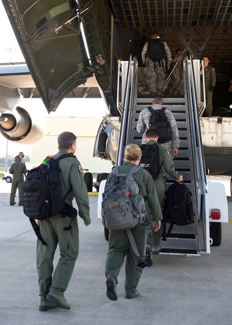 59th Medical Wing members start boarding a Lockheed C-5 Galaxy as the disaster relief team flying into Houston, Texas, August 30. More than 70-members of the Air Force’s flagship medical wing were mobilized to provide medical attention to the 6 million residents of the greater Houston area, after the city suffered catastrophic flooding due to Hurricane Harvey.