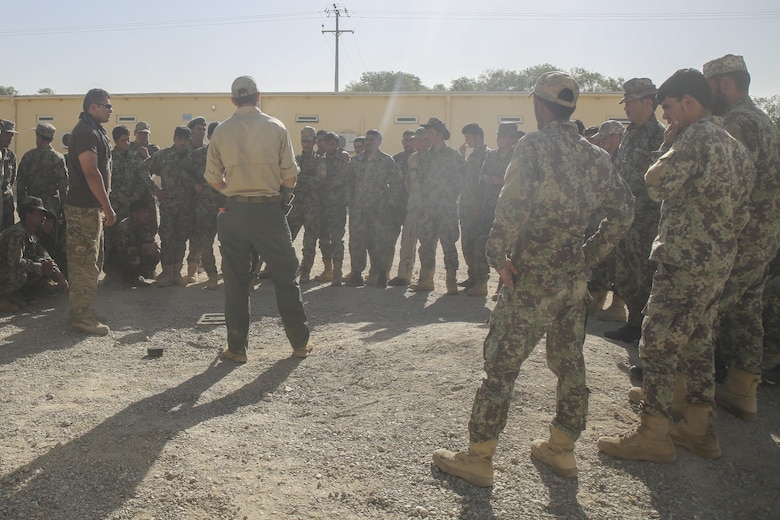 A counter improvised explosive device instructor teaches Afghan National Army soldiers with 215th Corps proper minesweeping procedures at Camp Shorabak, Afghanistan, Aug. 29, 2017. Approximately 70 engineer soldiers with various units from 215th Corps graduated from a route clearance course Aug. 30. Led by U.S. advisors, the curriculum focused on developing the Afghan’s tactics and procedures when locating and clearing IEDs, helping to improve mobility of troops and supplies on the battlefield. (U.S. Marine Corps photo by Sgt. Lucas Hopkins)