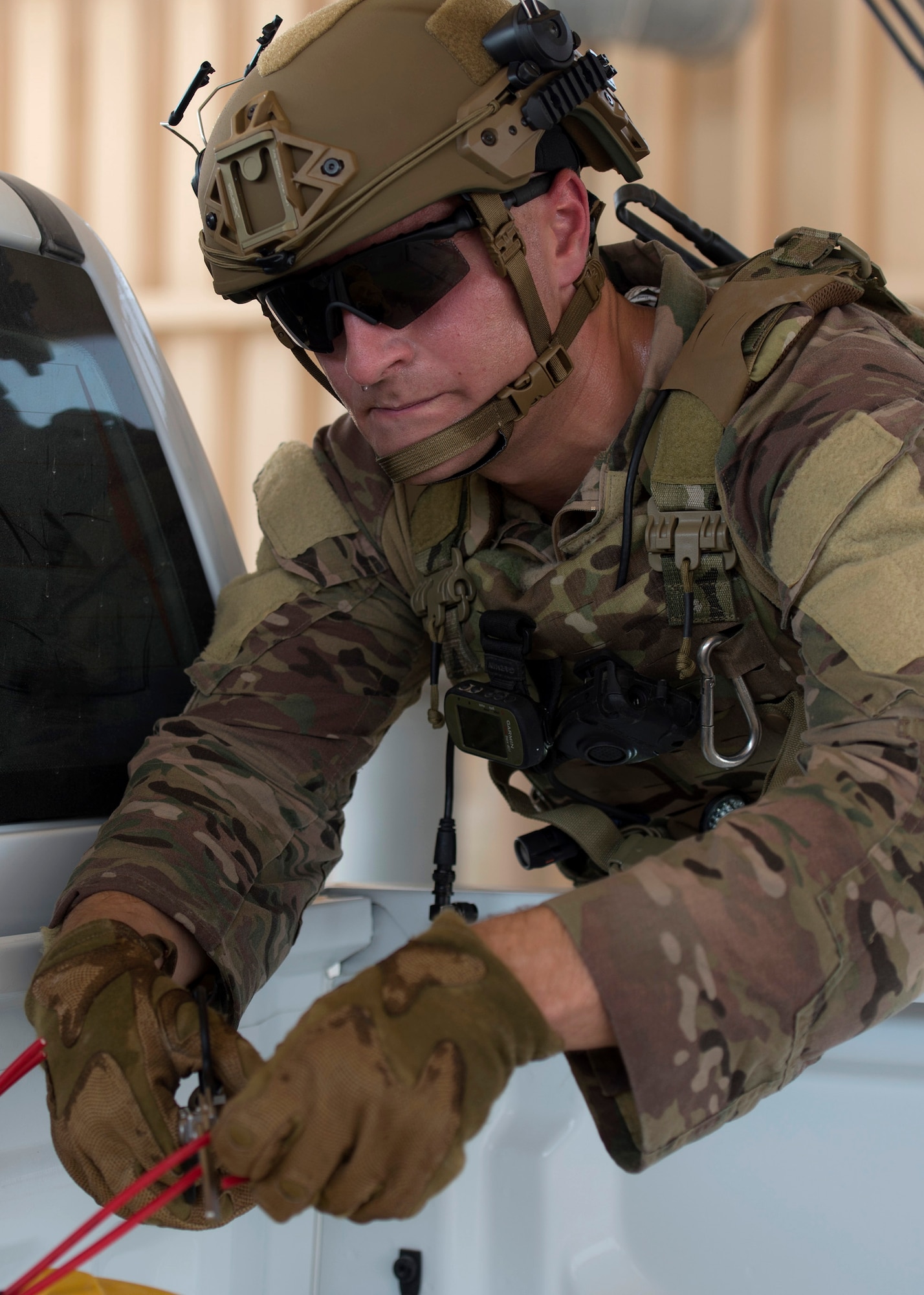 U.S. Air Force Staff Sgt. Brian Vosper, team leader with the 379th Expeditionary Civil Engineer Squadron Explosive Ordnance Disposal Flight, cuts the wires to a simulated explosive device at Al Udeid Air Base, Qatar, Aug. 26, 2017.