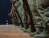 U.S. Air Force Airmen with the 379th Air Expeditionary Wing stand at parade rest with rifles at Al Udeid Air Base, Qatar, Aug. 9, 2017. The Airmen are taking part in an Al Udeid Air Base Honor Guard practice, The Airmen are taking part in an Al Udeid Air Base Honor Guard practice, learning the procedures and sequences that are required in order to perform a color detail. (U.S. Air Force photo by Tech. Sgt. Amy M. Lovgren)