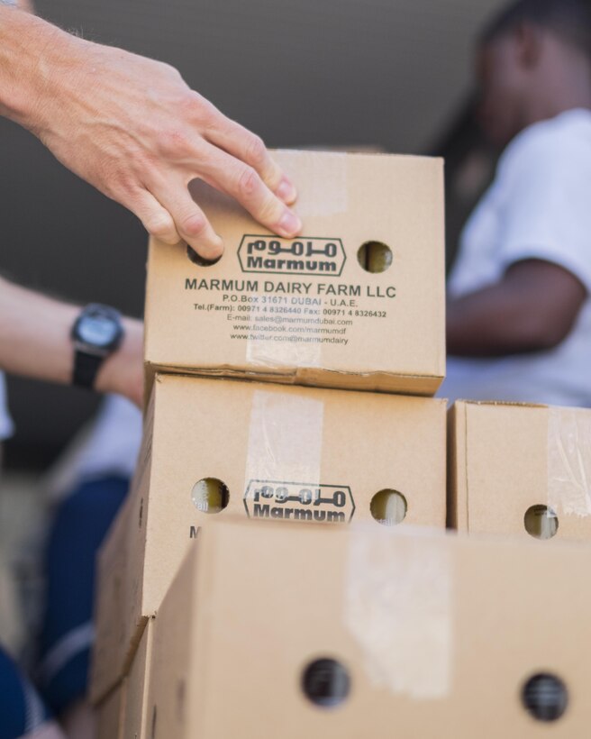 Brig. Gen. Derek C. France, 380th Air Expeditionary Wing commander, sorts pallets of food Aug. 31, 2017, at Al Dhafra Air Base, United Arab Emirates