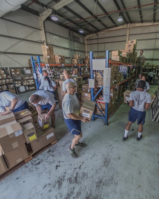 380th Air Expeditionary Wing leadership helps 380th Force Support Squadron personnel unload pallets of food Aug. 31, 2017, at Al Dhafra Air Base, United Arab Emirates.