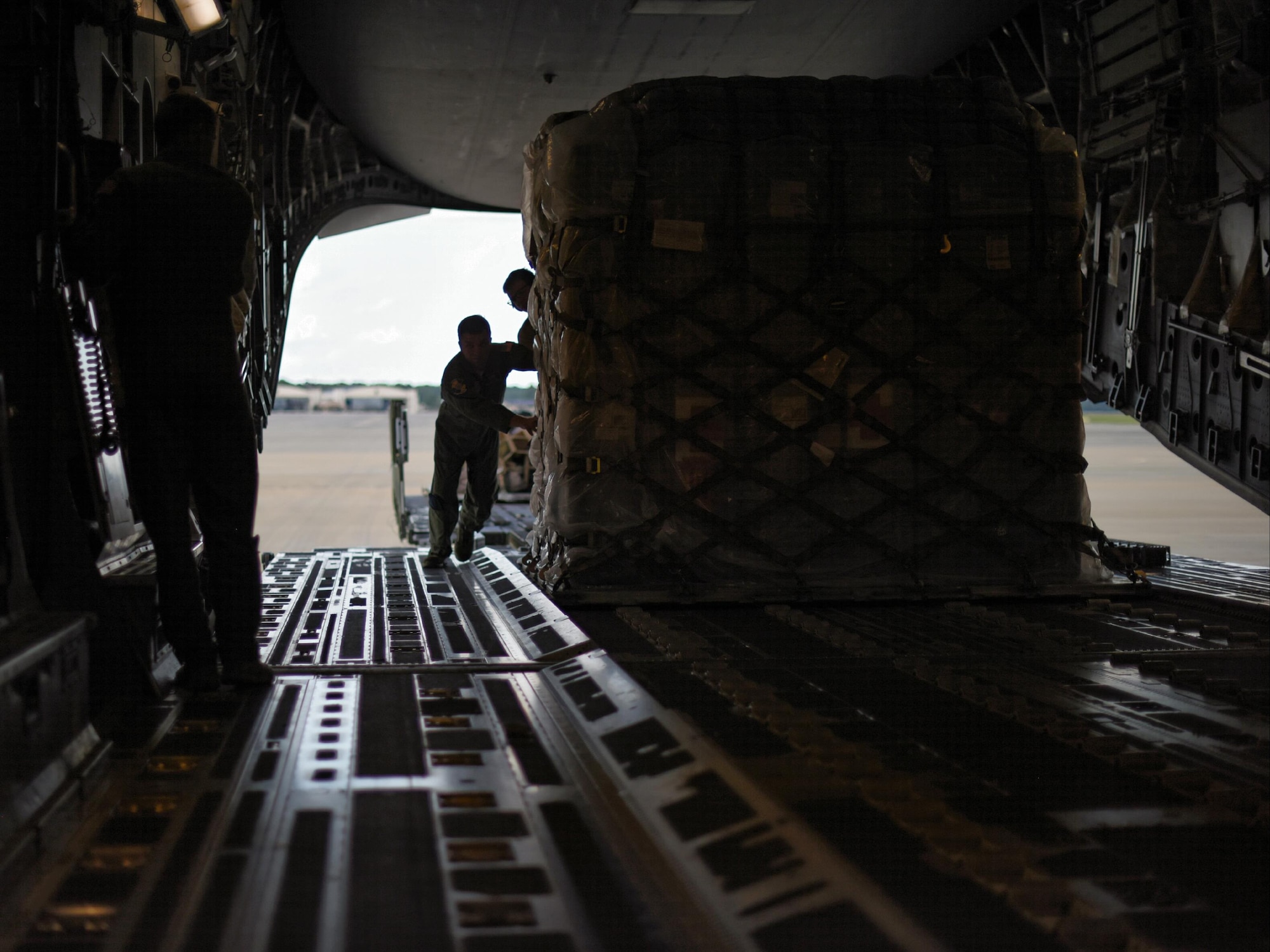 Staff Sgt. Bobby Newman, 43rd Aeromedical Evacuation Squadron aeromedical evacuation technician, guides a pallet of medical supplies onto a Joint Base Charleston C-17 Globemaster III at Pope Army Air Field, N.C., Aug. 30, 2017.