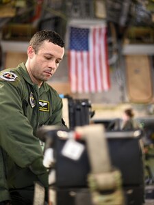 Capt. Stephen McCrory, 43rd Aeromedical Evacuation Squadron flight nurse, secures a generator used to power medical equipment to the inside of a C-17 Globemaster III during a humanitarian assistance and disaster relief mission at Pope Army Air Field, N.C, Aug. 30, 2017.