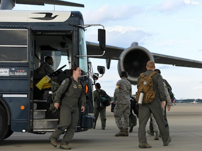 Airmen from the 43rd Aeromedical Evacuation Squadron prepare to board a Joint Base Charleston C-17 Globemaster III at Pope Army Air Field, N.C., Aug. 30, 2017.