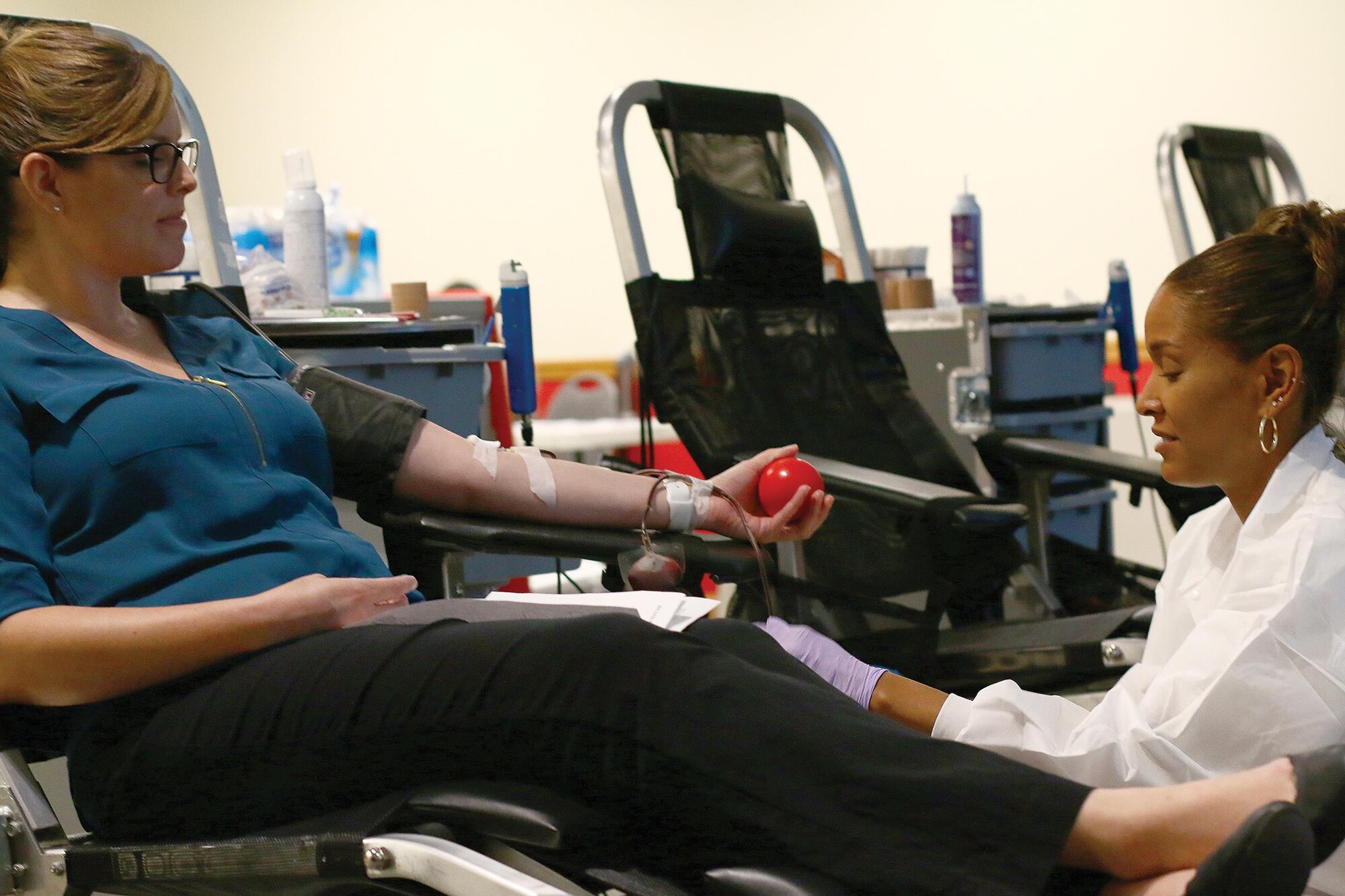 Tousha Huff, 88th Medical Squadron lab technician, draws blood from Jennifer Marquez, 445th Airlift Wing Director of Psychological Health, during the blood drive for the Armed Services Blood Program here August 1, 2017